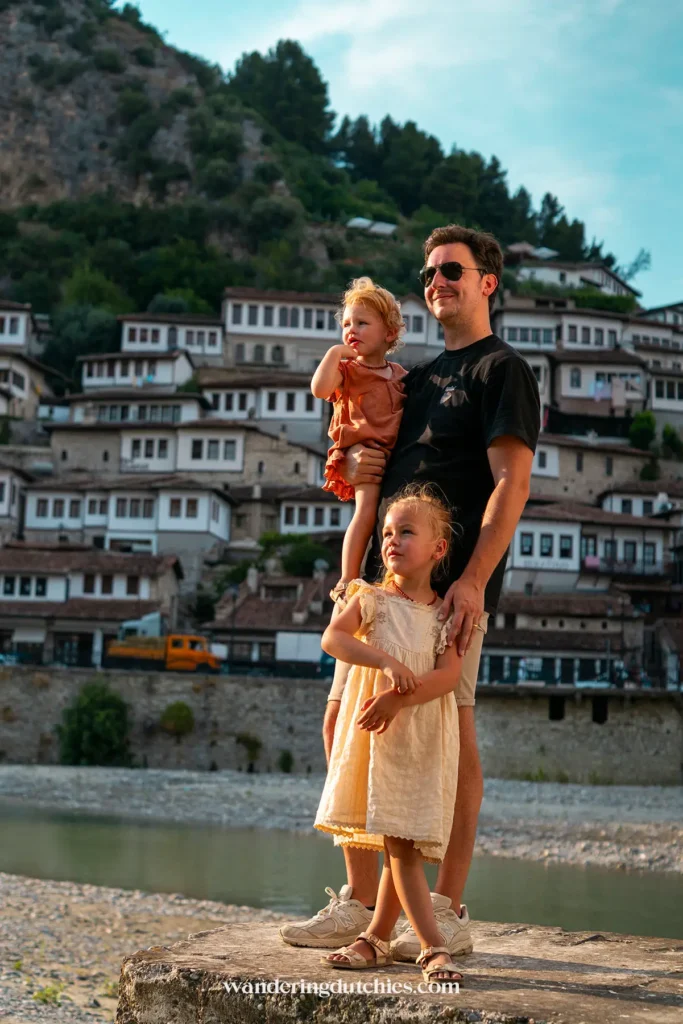 Father with his two daughters enjoying the view of the thousand windows in Berat, Albania.