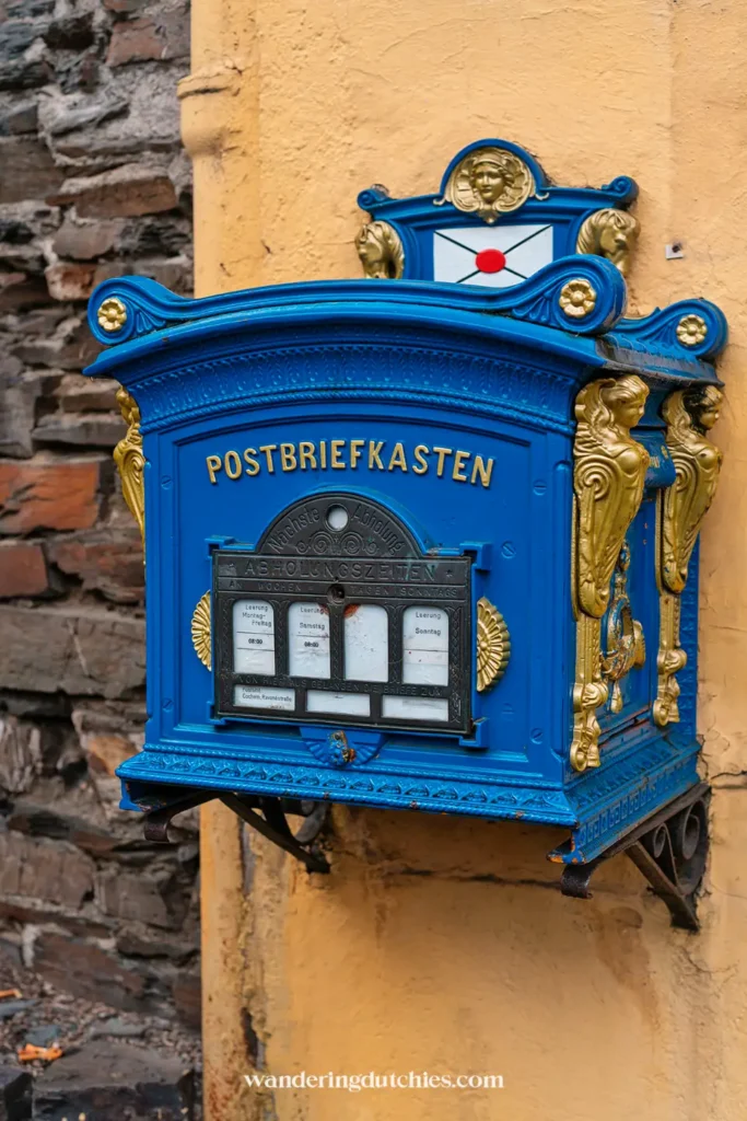 Historic blue mailbox in Cochem, Germany.