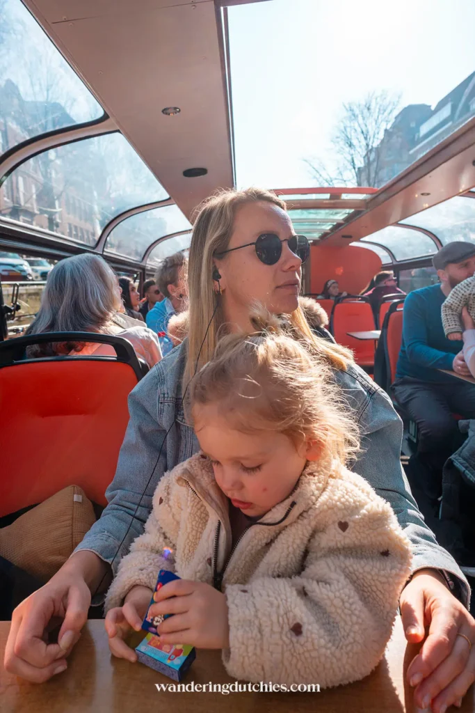 Family enjoying a canal cruise through Amsterdam's canals