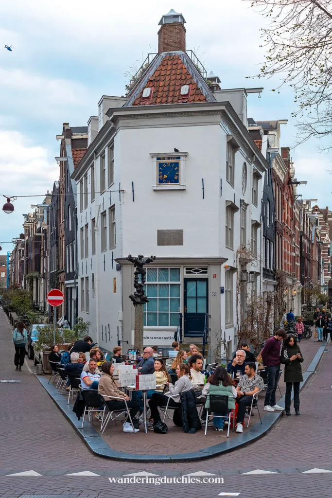 Outdoor café terrace on a street corner in the center of Amsterdam.