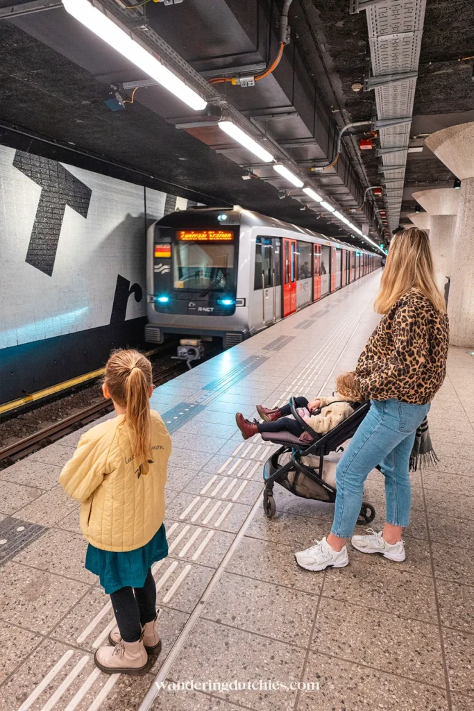 Family waiting for the metro in Amsterdam