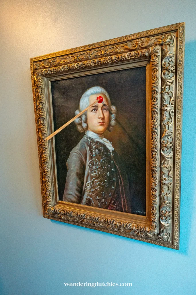 Portrait artwork with an arrow at the Moco Museum in Amsterdam