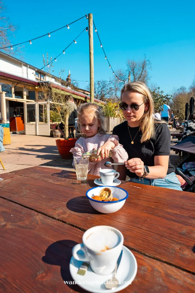 Mother and daughter relaxing on the terrace of Groot Melkhuis in Vondelpark