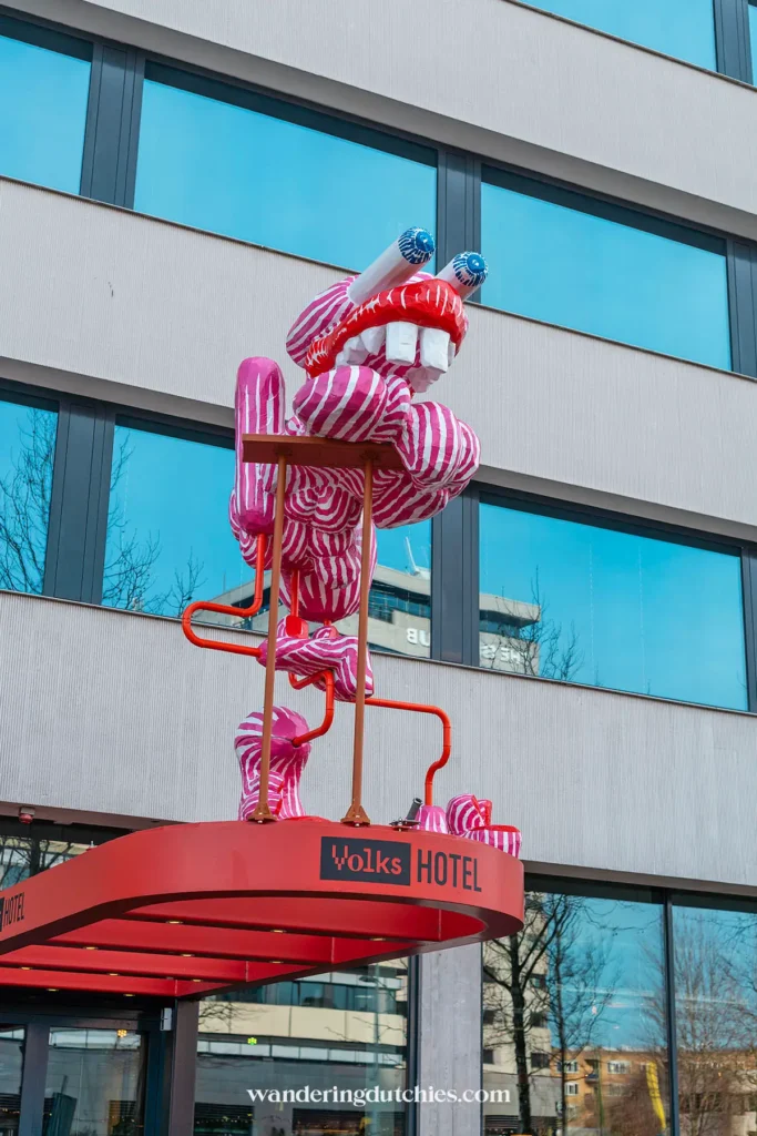 Artwork above the entrance of Volkshotel in Amsterdam